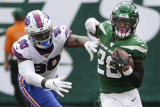 New York Jets' Le'Veon Bell (26) runs past Buffalo Bills' Shaq Lawson (90) during the second half of an NFL football game Sunday, Sept. 8, 2019, in East Rutherford, N.J. (AP Photo/Seth Wenig) New York Jets' Le'Veon Bell (26) runs past Buffalo Bills' Shaq Lawson (90) during the second half of an NFL football game Sunday, Sept. 8, 2019, in East Rutherford, N.J. (AP Photo/Seth Wenig)