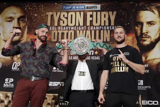 Tyson Fury, left, and Otto Wallin, of Sweden, pose for photos following a news conference Wednesday, Sept. 11, 2019, in Las Vegas. The pair will face each other in a heavyweight boxing match Saturday. (AP Photo/Isaac Brekken)