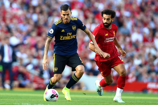 LIVERPOOL, ENGLAND - AUGUST 24: Dani Ceballos of Arsenal and Mohamed Salah of Liverpool in action during the Premier League match between Liverpool FC and Arsenal FC at Anfield on August 24, 2019 in Liverpool, United Kingdom. (Photo by Chloe Knott - Danehouse/Getty Images)