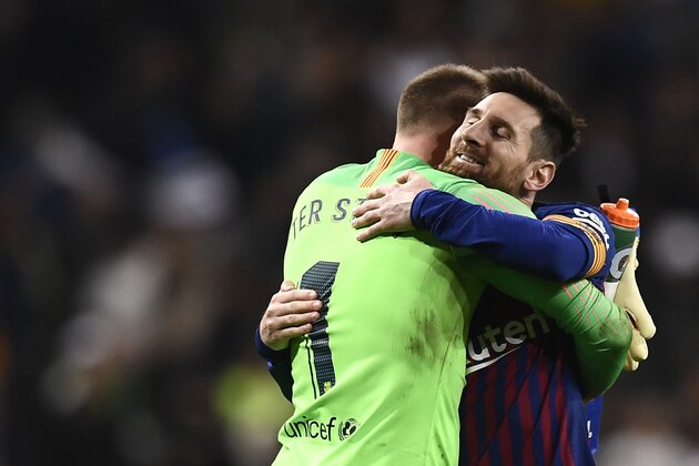 Barcelona's Argentinian forward Lionel Messi celebrates their win with Barcelona's German goalkeeper Marc-Andre Ter Stegen at the end of the Spanish Copa del Rey (King's Cup) semi-final second leg football match between Real Madrid and Barcelona at the Santiago Bernabeu stadium in Madrid on February 27, 2019. (Photo by OSCAR DEL POZO / AFP)        (Photo credit should read OSCAR DEL POZO/AFP/Getty Images)