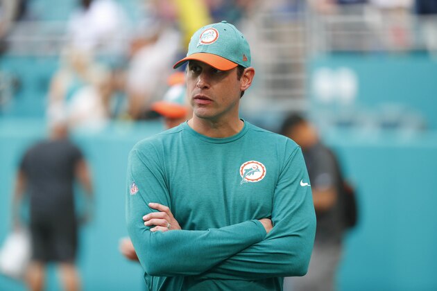 Miami Dolphins head coach Adam Gase watches the team warm up, before an NFL football game against the New England Patriots, Sunday, Dec. 9, 2018, in Miami Gardens, Fla. (AP Photo/Wilfredo Lee)