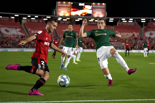 MALLORCA, SPAIN - SEPTEMBER 13: Joan Sastre of RCD Mallorca competes for the ball with Yuri Berchiche of Athletic Club during the Liga match between RCD Mallorca and Athletic Club at Iberostar Estadi on September 13, 2019 in Mallorca, Spain. (Photo by Quality Sport Images/Getty Images)