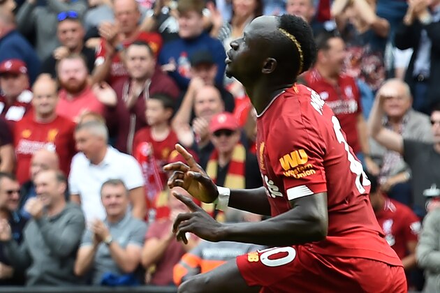 Liverpool's Senegalese striker Sadio Mane celebrates after he scores the team's second goal during the English Premier League football match between Liverpool and Newcastle at Anfield in Liverpool, north west England on September 14, 2019. (Photo by Paul ELLIS / AFP) / RESTRICTED TO EDITORIAL USE. No use with unauthorized audio, video, data, fixture lists, club/league logos or 'live' services. Online in-match use limited to 120 images. An additional 40 images may be used in extra time. No video emulation. Social media in-match use limited to 120 images. An additional 40 images may be used in extra time. No use in betting publications, games or single club/league/player publications. /         (Photo credit should read PAUL ELLIS/AFP/Getty Images)