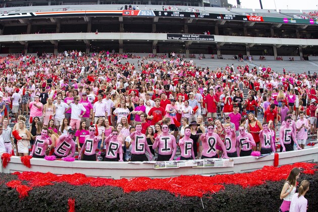 ATHENS, GA - SEPTEMBER 14: Georgia Bulldog fans are seen painted in pink in honor of Head Coach Blake Anderson's wife Wendy Anderson recently losing her battle with cancer prior to the start of the game against Arkansas State at Sanford Stadium on September 14, 2019 in Athens, Georgia. (Photo by Carmen Mandato/Getty Images)