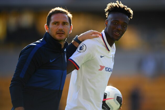 WOLVERHAMPTON, ENGLAND - SEPTEMBER 14: Tammy Abraham of Chelsea with the match ball and his manager Frank Lampard after his hatrick following the the Premier League match between Wolverhampton Wanderers and Chelsea FC at Molineux on September 14, 2019 in Wolverhampton, United Kingdom. (Photo by Clive Mason/Getty Images)