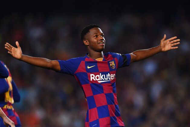 BARCELONA, SPAIN - SEPTEMBER 14:   Anssumane Fati of Barcelona celebrates after scoring his team's first goal during the Liga match between FC Barcelona and Valencia CF at Camp Nou on September 14, 2019 in Barcelona, Spain. (Photo by Alex Caparros/Getty Images)