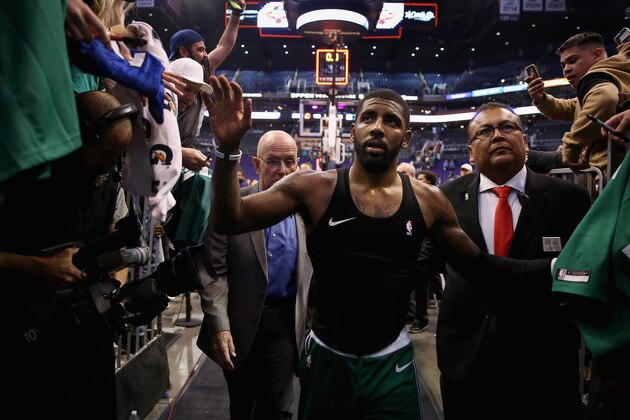 PHOENIX, AZ - NOVEMBER 08: Kyrie Irving #11 of the Boston Celtics high fives fans as he walks off the court following the NBA game against the Phoenix Suns at Talking Stick Resort Arena on November 8, 2018 in Phoenix, Arizona. The Celetics defeated the Suns 116-109 in overtime. NOTE TO USER: User expressly acknowledges and agrees that, by downloading and or using this photograph, User is consenting to the terms and conditions of the Getty Images License Agreement. (Photo by Christian Petersen/Getty Images) PHOENIX, AZ - NOVEMBER 08: Kyrie Irving #11 of the Boston Celtics high fives fans as he walks off the court following the NBA game against the Phoenix Suns at Talking Stick Resort Arena on November 8, 2018 in Phoenix, Arizona. The Celetics defeated the Suns 116-109 in overtime. NOTE TO USER: User expressly acknowledges and agrees that, by downloading and or using this photograph, User is consenting to the terms and conditions of the Getty Images License Agreement. (Photo by Christian Petersen/Getty Images)