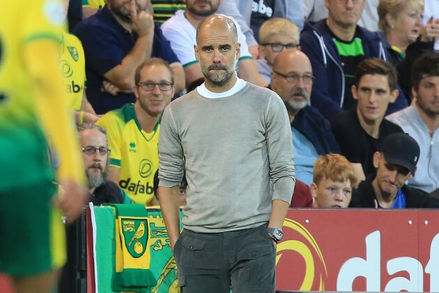 Manchester City's Spanish manager Pep Guardiola gestures on the touchline during the English Premier League football match between Norwich City and Manchester City at Carrow Road in Norwich, eastern England on September 14, 2019. - Norwich won the game 3-2. (Photo by Lindsey Parnaby / AFP) / RESTRICTED TO EDITORIAL USE. No use with unauthorized audio, video, data, fixture lists, club/league logos or 'live' services. Online in-match use limited to 120 images. An additional 40 images may be used in extra time. No video emulation. Social media in-match use limited to 120 images. An additional 40 images may be used in extra time. No use in betting publications, games or single club/league/player publications. /         (Photo credit should read LINDSEY PARNABY/AFP/Getty Images)