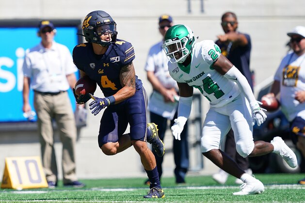 BERKELEY, CA - SEPTEMBER 14: Nikko Remigio #4 of the California Golden Bears scores on a 36 yard touchdown pass against North Texas Mean Green during the first quarter of an NCAA football game at California Memorial Stadium on September 14, 2019 in Berkeley, California. (Photo by Thearon W. Henderson/Getty Images)
