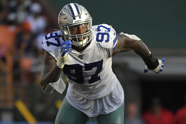 Dallas Cowboys defensive end Taco Charlton runs a play during the first half of a preseason NFL football game against the Los Angeles Rams Saturday, Aug. 17, 2019, in Honolulu. (AP Photo/Mark J. Terrill)