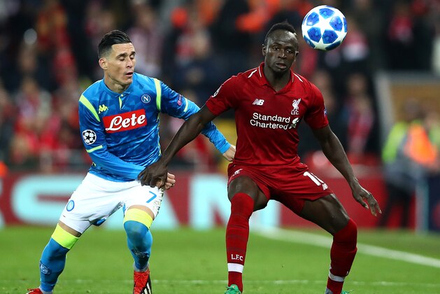 LIVERPOOL, ENGLAND - DECEMBER 11: Sadio Mane of Liverpool in action with Jose Callejon of Napoli during the UEFA Champions League Group C match between Liverpool and SSC Napoli at Anfield on December 11, 2018 in Liverpool, United Kingdom. (Photo by Clive Brunskill/Getty Images)