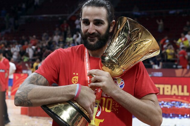 Ricky Rubio of Spain holds the Naismith Trophy after they beat Argentina in their first-place match in the FIBA Basketball World Cup at the Cadillac Arena in Beijing, Sunday, Sept. 15, 2019. (AP Photo/Mark Schiefelbein)