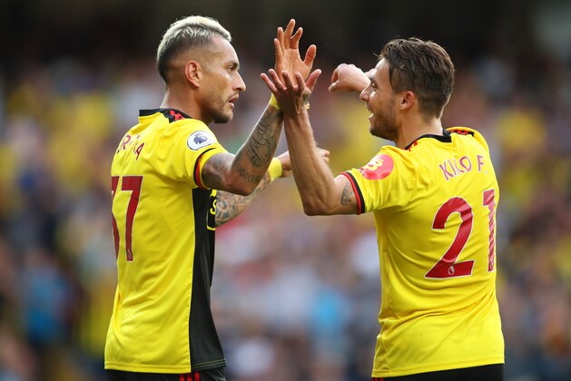 WATFORD, ENGLAND - SEPTEMBER 15:  Roberto Pereyra of Watford celebrates as he scores his team's second goal from a penalty with Kiko Femenia during the Premier League match between Watford FC and Arsenal FC at Vicarage Road on September 15, 2019 in Watford, United Kingdom. (Photo by Marc Atkins/Getty Images)