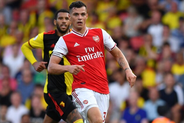 Arsenal's Swiss midfielder Granit Xhaka controls the ball during the English Premier League football match between Watford and Arsenal at Vicarage Road Stadium in Watford, north of London on September 15, 2019. (Photo by Ben STANSALL / AFP) / RESTRICTED TO EDITORIAL USE. No use with unauthorized audio, video, data, fixture lists, club/league logos or 'live' services. Online in-match use limited to 120 images. An additional 40 images may be used in extra time. No video emulation. Social media in-match use limited to 120 images. An additional 40 images may be used in extra time. No use in betting publications, games or single club/league/player publications. /         (Photo credit should read BEN STANSALL/AFP/Getty Images)