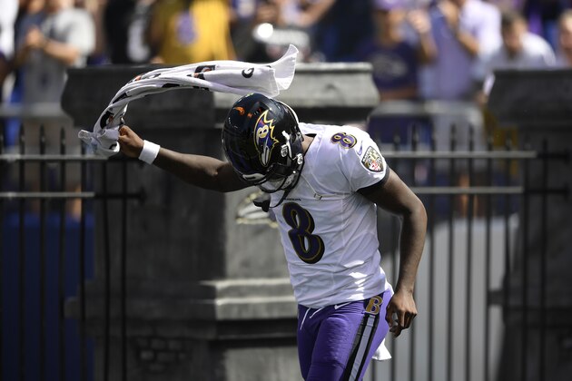 Baltimore Ravens quarterback Lamar Jackson runs onto the field as he is introduced before an NFL football game against the Arizona Cardinals, Sunday, Sept. 15, 2019, in Baltimore. (AP Photo/Nick Wass)