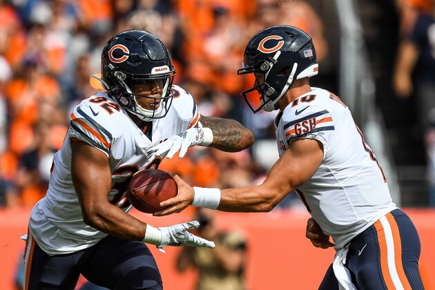 DENVER, CO - SEPTEMBER 15:  Mitchell Trubisky #10 of the Chicago Bears hands off to David Montgomery #32 in the second quarter of a game at Empower Field at Mile High on September 15, 2019 in Denver, Colorado. (Photo by Dustin Bradford/Getty Images)