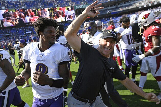 Baltimore Ravens quarterback Lamar Jackson, left, celebrates with head coach John Harbaugh after an NFL football game against the Arizona Cardinals, Sunday, Sept. 15, 2019, in Baltimore. Baltimore won 23-17. (AP Photo/Nick Wass)