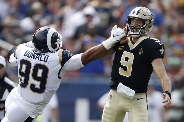 LOS ANGELES, CALIFORNIA - SEPTEMBER 15:  Drew Brees #9 of the New Orleans Saints injures his throwing hand as he is hit by Aaron Donald #99 of the Los Angeles Rams during the first quarter in the gameat Los Angeles Memorial Coliseum on September 15, 2019 in Los Angeles, California. (Photo by Sean M. Haffey/Getty Images)