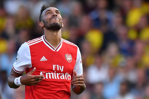 Arsenal's Gabonese striker Pierre-Emerick Aubameyang reacts to a missed chance during the English Premier League football match between Watford and Arsenal at Vicarage Road Stadium in Watford, north of London on September 15, 2019. (Photo by Ben STANSALL / AFP) / RESTRICTED TO EDITORIAL USE. No use with unauthorized audio, video, data, fixture lists, club/league logos or 'live' services. Online in-match use limited to 120 images. An additional 40 images may be used in extra time. No video emulation. Social media in-match use limited to 120 images. An additional 40 images may be used in extra time. No use in betting publications, games or single club/league/player publications. /         (Photo credit should read BEN STANSALL/AFP/Getty Images)