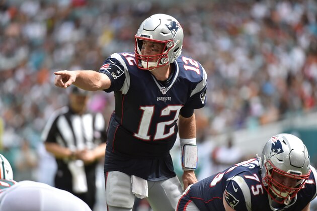 MIAMI, FL - SEPTEMBER 15: Tom Brady #12 of the New England Patriots points to the defense during the third quarter of the game against the Miami Dolphins at Hard Rock Stadium on September 15, 2019 in Miami, Florida. (Photo by Eric Espada/Getty Images)