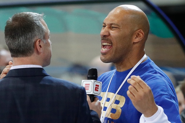 FILE - In this Jan. 9, 2018, file photo, LaVar Ball is interviewed after a basketball game in Prienai, Lithuania. LiAngelo and LaMelo Ball are leaving their Lithuania team by mutual agreement. BC Prienu Vytautas on Thursday, April 26, 2018, announced the departure of the younger brothers of Los Angeles Lakers rookie Lonzo Ball. Lithuanian basketball writer Donatas Urbonas says on Twitter that father LaVar Ball told him he was upset over LaMelo's diminished playing time. (AP Photo/Liusjenas Kulbis, File)