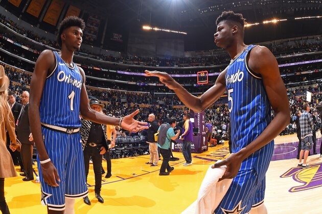 LOS ANGELES, CA - NOVEMBER 25: Jonathan Isaac #1 and Mohamed Bamba #5 of the Orlando Magic high-five during a game against the Los Angeles Lakers on November 25, 2018 at STAPLES Center in Los Angeles, California. NOTE TO USER: User expressly acknowledges and agrees that, by downloading and/or using this Photograph, user is consenting to the terms and conditions of the Getty Images License Agreement. Mandatory Copyright Notice: Copyright 2018 NBAE (Photo by Andrew D. Bernstein/NBAE via Getty Images)