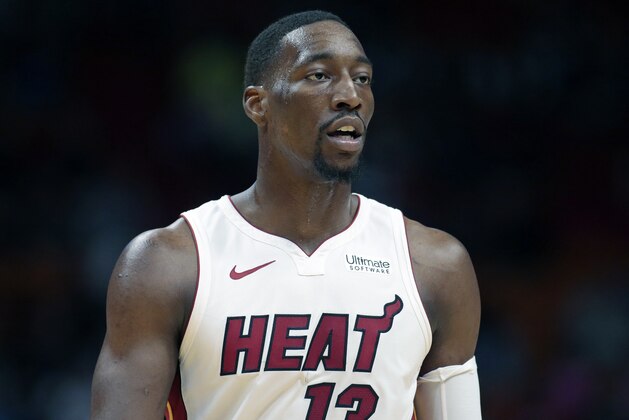 Miami Heat center Bam Adebayo (13) looks on during the first half of an NBA basketball game, Thursday, March 28, 2019, in Miami. The Heat defeated the Mavericks 105-99. (AP Photo/Joel Auerbach)