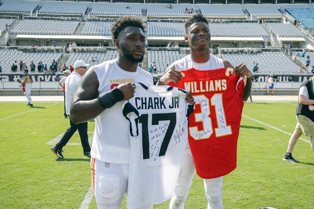 Jacksonville Jaguars wide receiver D.J. Chark, right, and Kansas City Chiefs running back Darrel Williams, left, hold each other's jerseys after an NFL football game, Sunday, Sept. 8, 2019, in Jacksonville, Fla. (AP Photo/Stephen B. Morton)