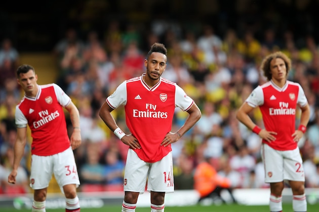 WATFORD, ENGLAND - SEPTEMBER 15:  Pierre-Emerick Aubameyang of Arsenal (14) and team mates Granit Xhaka and David Luiz react during the Premier League match between Watford FC and Arsenal FC at Vicarage Road on September 15, 2019 in Watford, United Kingdom. (Photo by Marc Atkins/Getty Images)