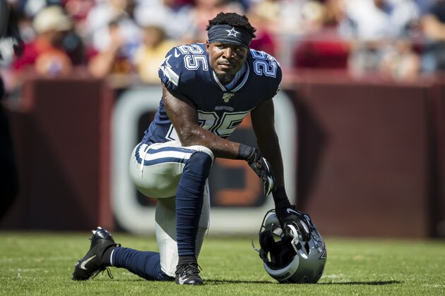 LANDOVER, MD - SEPTEMBER 15: Xavier Woods #25 of the Dallas Cowboys takes a knee during an injury timeout against the Washington Redskins during the first half at FedExField on September 15, 2019 in Landover, Maryland. (Photo by Scott Taetsch/Getty Images)