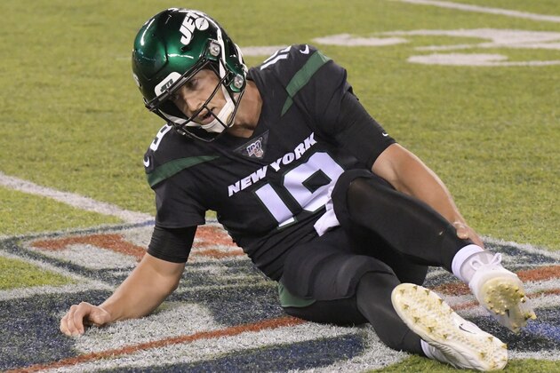 New York Jets quarterback Trevor Siemian (19) grabs his leg after being hurt during the first half of an NFL football game against the Cleveland Browns Monday, Sept. 16, 2019, in East Rutherford, N.J. (AP Photo/Bill Kostroun)