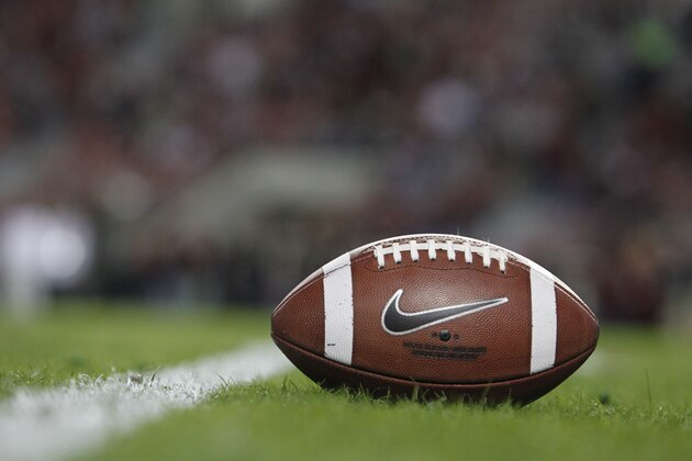 Footballs lie on the field during the first half of an NCAA college football game between the Alabama Crimson Tide and the LSU Tigers, Saturday, Nov. 9, 2013, in Tuscaloosa, Ala. (AP Photo/Butch Dill)
