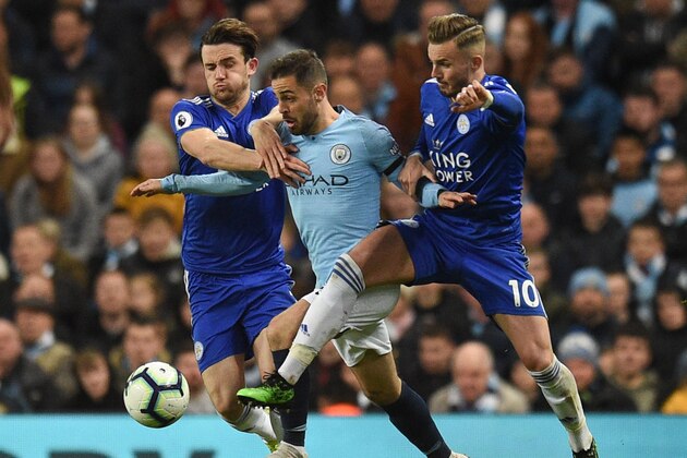 TOPSHOT - Leicester City's English defender Ben Chilwell (L) and Leicester City's English midfielder James Maddison (R) challenge Manchester City's Portuguese midfielder Bernardo Silva (C) during the English Premier League football match between Manchester City and Leicester City at the Etihad Stadium in Manchester, north west England, on May 6, 2019. (Photo by Oli SCARFF / AFP) / RESTRICTED TO EDITORIAL USE. No use with unauthorized audio, video, data, fixture lists, club/league logos or 'live' services. Online in-match use limited to 120 images. An additional 40 images may be used in extra time. No video emulation. Social media in-match use limited to 120 images. An additional 40 images may be used in extra time. No use in betting publications, games or single club/league/player publications. / (Photo credit should read OLI SCARFF/AFP/Getty Images) TOPSHOT - Leicester City's English defender Ben Chilwell (L) and Leicester City's English midfielder James Maddison (R) challenge Manchester City's Portuguese midfielder Bernardo Silva (C) during the English Premier League football match between Manchester City and Leicester City at the Etihad Stadium in Manchester, north west England, on May 6, 2019. (Photo by Oli SCARFF / AFP) / RESTRICTED TO EDITORIAL USE. No use with unauthorized audio, video, data, fixture lists, club/league logos or 'live' services. Online in-match use limited to 120 images. An additional 40 images may be used in extra time. No video emulation. Social media in-match use limited to 120 images. An additional 40 images may be used in extra time. No use in betting publications, games or single club/league/player publications. / (Photo credit should read OLI SCARFF/AFP/Getty Images)