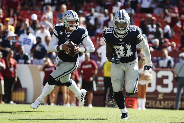 Dallas Cowboys quarterback Dak Prescott (4) and running back Ezekiel Elliott (21) on the field during the second half of an NFL football game, Sunday, Sept. 15, 2019, in Landover, Md. (AP Photo/Alex Brandon) Dallas Cowboys quarterback Dak Prescott (4) and running back Ezekiel Elliott (21) on the field during the second half of an NFL football game, Sunday, Sept. 15, 2019, in Landover, Md. (AP Photo/Alex Brandon)