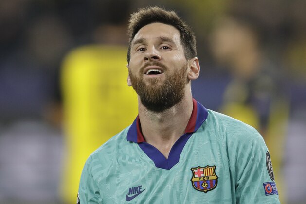 Barcelona's Lionel Messi smiles at the end of the Champions League Group F soccer match between Borussia Dortmund and FC Barcelona in Dortmund, Germany, Tuesday, Sept. 17, 2019. (AP Photo/Michael Probst)