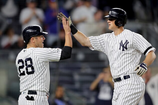 NEW YORK, NEW YORK - SEPTEMBER 19:  DJ LeMahieu #26 of the New York Yankees celebrates his three run home run with teammate Austin Romine #28 in the second inning against the Los Angeles Angels at Yankee Stadium on September 19, 2019 in Bronx borough of New York City. (Photo by Elsa/Getty Images)