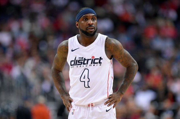 FILE - In this April 22, 2018, file photo, Washington Wizards guard Ty Lawson (4) looks on during the second half of Game 4 of an NBA basketball first-round playoff series against the Toronto Raptors, in Washington. Less than three weeks ago, Lawson was playing professional basketball in China. Nowadays, he's been one of the first subs off the bench for the Washington Wizards in their Eastern Conference first-round playoff series against the No. 1 seed Toronto Raptors (AP Photo/Nick Wass, File)