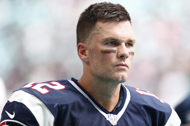 New England Patriots quarterback Tom Brady (12) watches from the sidelines, during the second half at an NFL football game against the Miami Dolphins, Sunday, Sept. 15, 2019, in Miami Gardens, Fla. (AP Photo/Brynn Anderson)