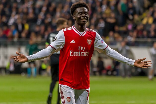 FRANKFURT AM MAIN, GERMANY - SEPTEMBER 19: Bukayo Saka of FC Arsenal celebrates after scoring his team's second goal during the UEFA Europa League group F match between Eintracht Frankfurt and Arsenal FC on September 19, 2019 in Frankfurt am Main, Germany. (Photo by TF-Images/Getty Images)