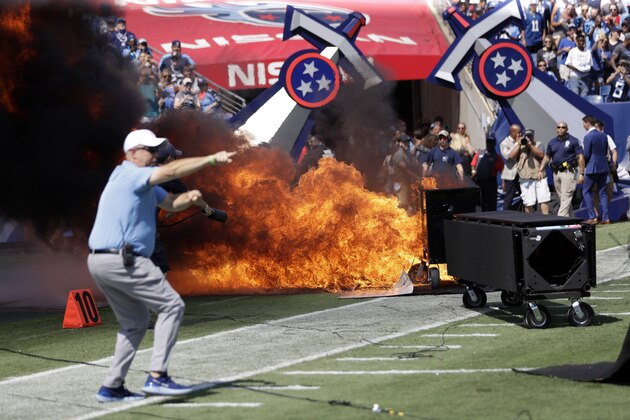FILE - In this Sunday, Sept. 15, 2019, file photo, a fire from a pyrotechnics machine burns on the field before an NFL football game between the Tennessee Titans and the Indianapolis Colts, in Nashville, Tenn. The NFL has banned any on-field pyrotechnics and