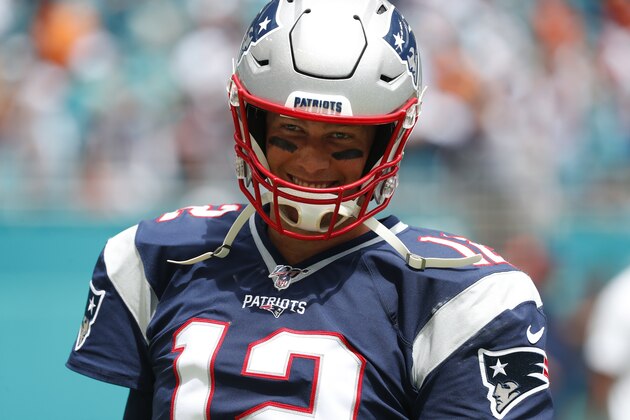 New England Patriots quarterback Tom Brady (12) smiles before an NFL football game against the Miami Dolphins, Sunday, Sept. 15, 2019, in Miami Gardens, Fla. (AP Photo/Wilfredo Lee)