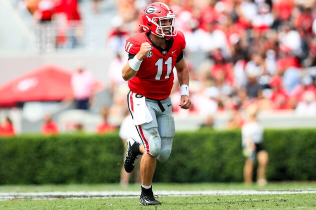 ATHENS, GA - SEPTEMBER 14: Jake Fromm #11 reacts to James Cook #4 of the Georgia Bulldogs scoring a touchdown on a 37 yard run during the second half of a game against the Arkansas State Red Wolves at Sanford Stadium on September 14, 2019 in Athens, Georgia. (Photo by Carmen Mandato/Getty Images)