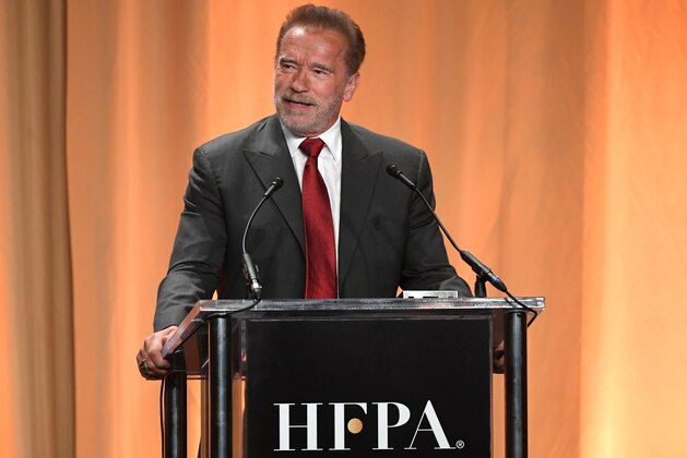 BEVERLY HILLS, CALIFORNIA - JULY 31: Arnold Schwarzenegger speaks  onstage during Hollywood Foreign Press Association's Annual Grants Banquet at Regent Beverly Wilshire Hotel on July 31, 2019 in Beverly Hills, California. (Photo by Kevin Winter/Getty Images)