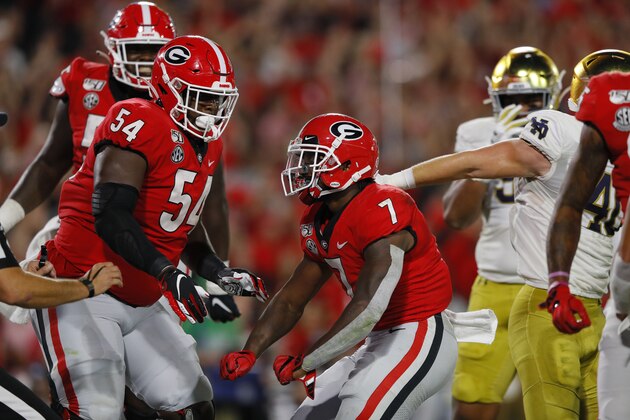 ATHENS, GEORGIA - SEPTEMBER 21: D'Andre Swift #7 of the Georgia Bulldogs celebrates his second quarter touchdown with Justin Shaffer #54 while playing the Notre Dame Fighting Irish at Sanford Stadium on September 21, 2019 in Athens, Georgia. (Photo by Kevin C. Cox/Getty Images) ATHENS, GEORGIA - SEPTEMBER 21: D'Andre Swift #7 of the Georgia Bulldogs celebrates his second quarter touchdown with Justin Shaffer #54 while playing the Notre Dame Fighting Irish at Sanford Stadium on September 21, 2019 in Athens, Georgia. (Photo by Kevin C. Cox/Getty Images)