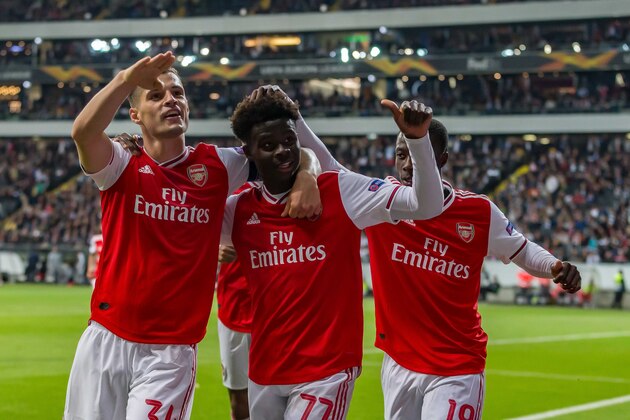 FRANKFURT AM MAIN, GERMANY - SEPTEMBER 19: Granit Xhaka of Arsenal FC, Bukayo Saka of Arsenal FC and Nicolas Pepe of Arsenal FC celebrates after scoring his team's second goal during the UEFA Europa League group F match between Eintracht Frankfurt and Arsenal FC at  on September 19, 2019 in Frankfurt am Main, Germany. (Photo by TF-Images/Getty Images)