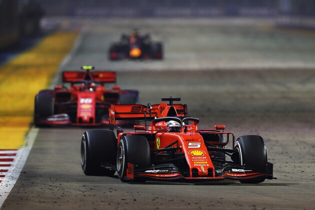 SINGAPORE, SINGAPORE - SEPTEMBER 22: Sebastian Vettel of Germany driving the (5) Scuderia Ferrari SF90 leads Charles Leclerc of Monaco driving the (16) Scuderia Ferrari SF90 on track during the F1 Grand Prix of Singapore at Marina Bay Street Circuit on September 22, 2019 in Singapore. (Photo by Lars Baron/Getty Images) SINGAPORE, SINGAPORE - SEPTEMBER 22: Sebastian Vettel of Germany driving the (5) Scuderia Ferrari SF90 leads Charles Leclerc of Monaco driving the (16) Scuderia Ferrari SF90 on track during the F1 Grand Prix of Singapore at Marina Bay Street Circuit on September 22, 2019 in Singapore. (Photo by Lars Baron/Getty Images)