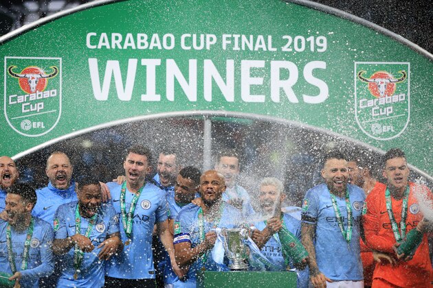 LONDON, ENGLAND - FEBRUARY 24: Manchester City players led by Vincent Kompany of celebrate with the trophy during the Carabao Cup Final between Chelsea and Manchester City at Wembley Stadium on February 24, 2019 in London, England. (Photo by Marc Atkins/Getty Images)