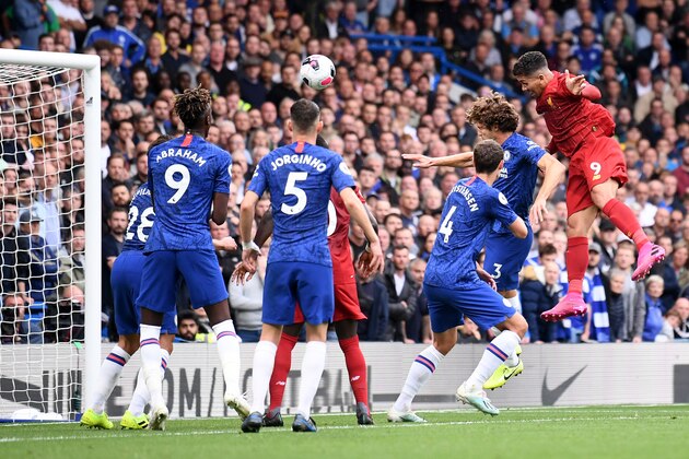 LONDON, ENGLAND - SEPTEMBER 22: Roberto Firmino of Liverpool heads home his teams second goal during the Premier League match between Chelsea FC and Liverpool FC at Stamford Bridge on September 22, 2019 in London, United Kingdom. (Photo by Laurence Griffiths/Getty Images)
