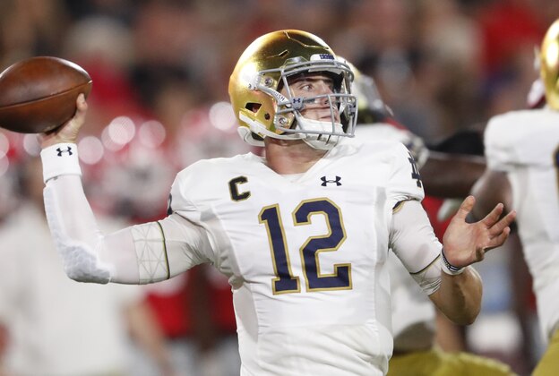 Notre Dame quarterback Ian Book (12) works in the pocket against Georgia during the first half of an NCAA college football game, Saturday, Sept. 21, 2019, in Athens, Ga. (AP Photo/John Bazemore)