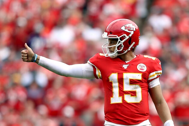 KANSAS CITY, MISSOURI - SEPTEMBER 22:  Quarterback Patrick Mahomes #15 of the Kansas City Chiefs celebrates as the Chiefs defeat the Baltimore Ravens 33-28 to win the game at Arrowhead Stadium on September 22, 2019 in Kansas City, Missouri. (Photo by Jamie Squire/Getty Images)
